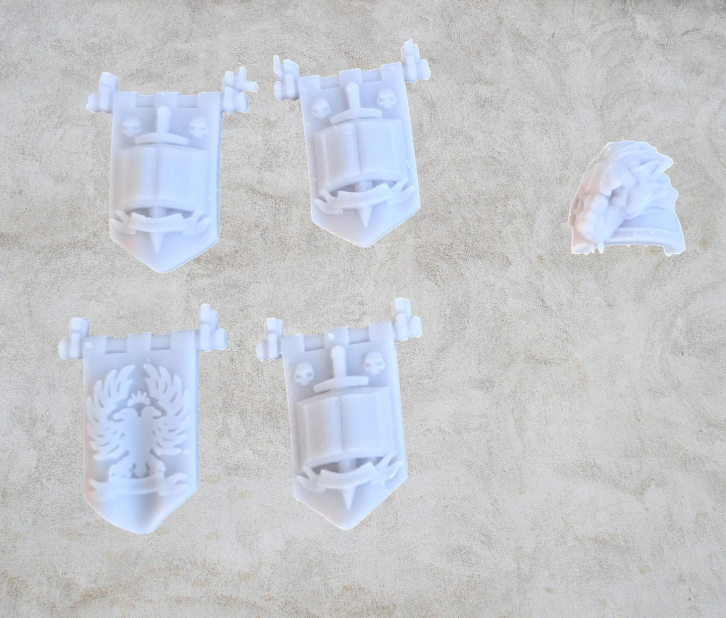 Grey guys weapons banners (shoulder pad is for size comparison only and not included).